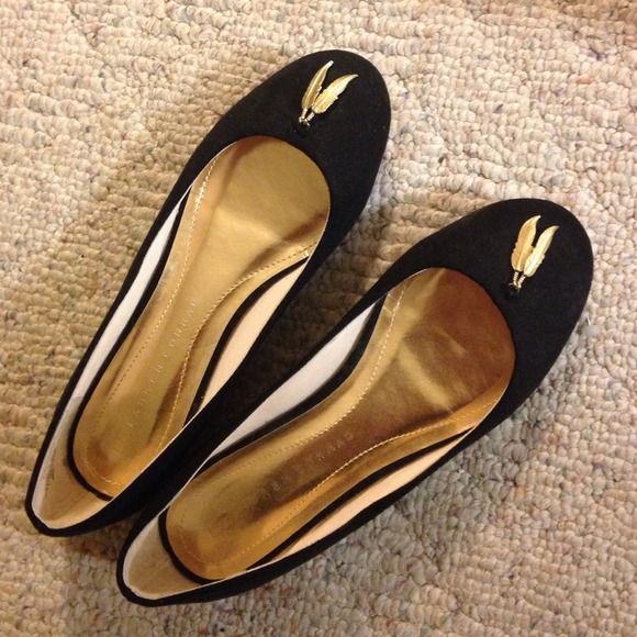 Black suede flats with feather accent