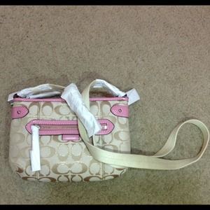 Pink coach cross body. Fun and compact!