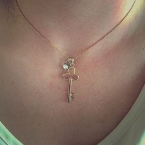 Gold key and gem necklace