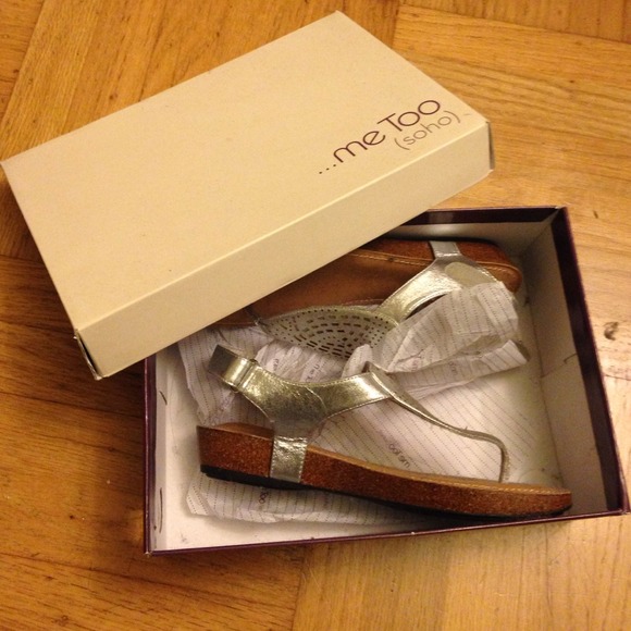 Tan sandals with a silver strap