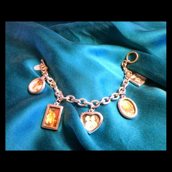REDUCED!Silver charm bracelet that holds pictures.