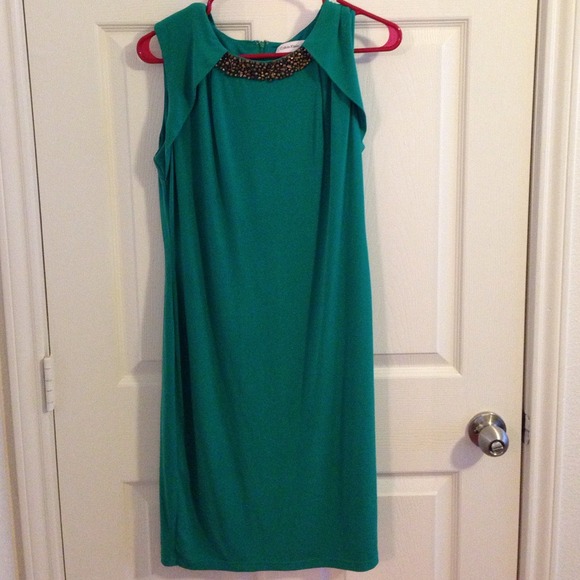 Green Calvin Klein dress with gold embellishments