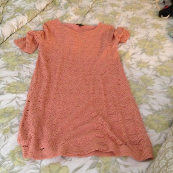 Peach color lace dress.