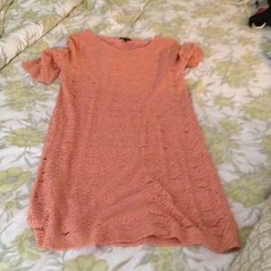 Peach color lace dress.