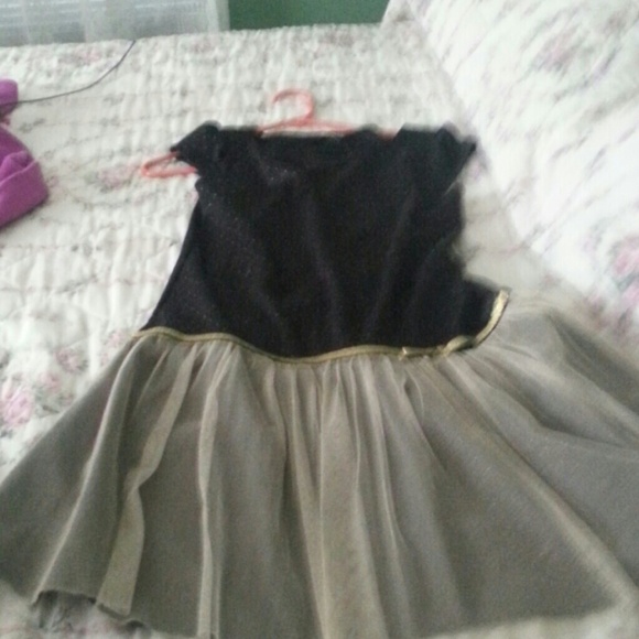 A short black and gold dress