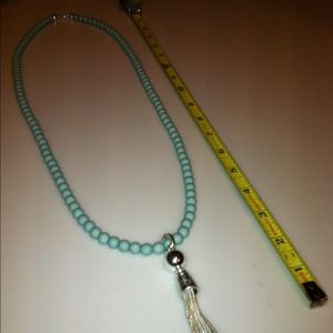 Awesome teal blue necklace with silver dangle.