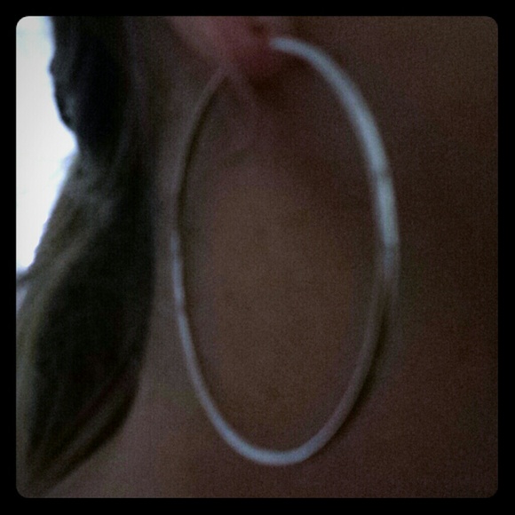 Brand new sterling silver 50" hoop earrings