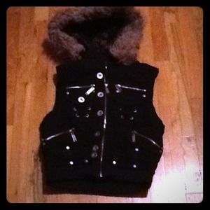 Zip up vest with fur hood.