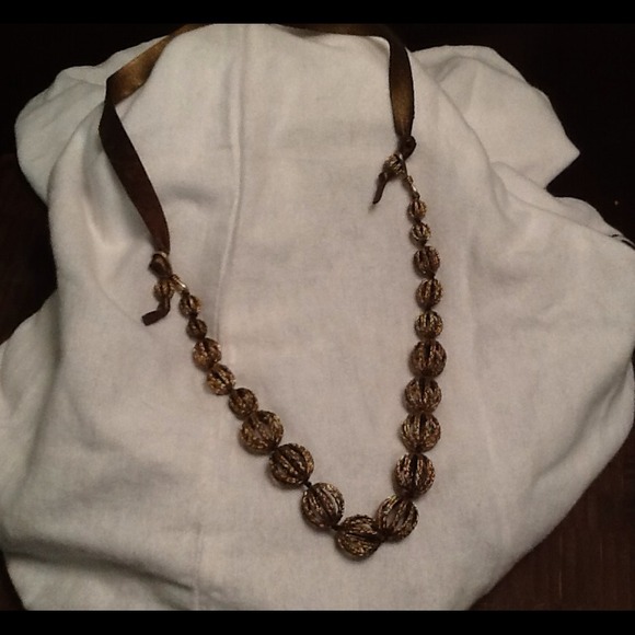 Antiqued gold and leather necklace