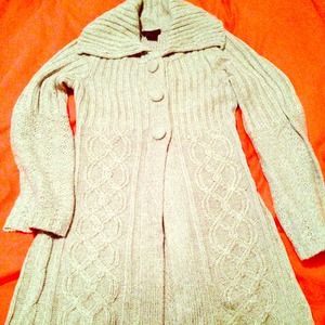 Long sweater with three large buttons