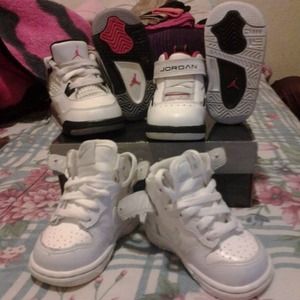 Two pair of jordans and a pair of nike