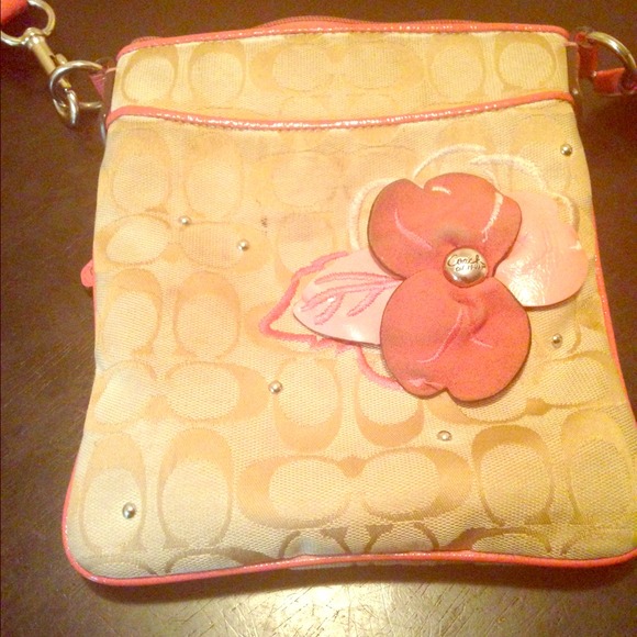 Pink and tan Coach messenger bag