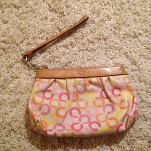 Spring colored coach clutch