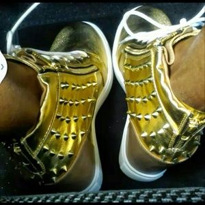 Gold sneaker wedges and spiked bra combo