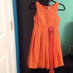 An orange dress fit for tea parties.