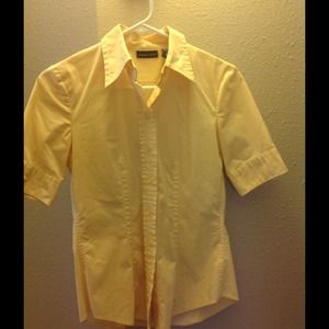 Yellow button down collared shirt