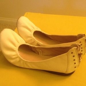 White flats with zippers