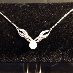 Cute little petal necklace with jeweling.