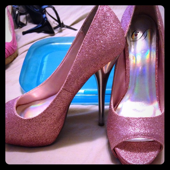 Pair of hot pink glitter heels.