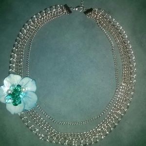 4 row Silvertone chain necklace with shell flower