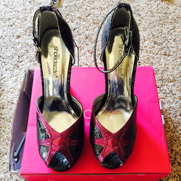 Fun, snake skin high heals. NEVER WORN