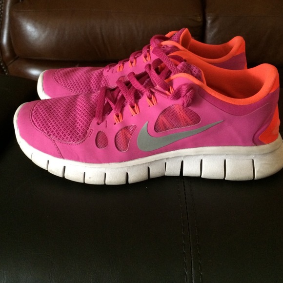 Orange and pink nikes size 6.5 youth