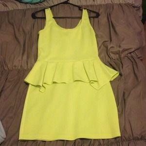 Neon yellow peplum body con dress.