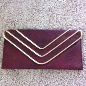 Burgundy clutch with gold trim