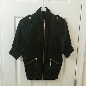 Black jacket with gold hardware