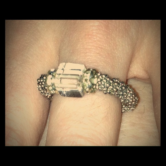 Silver colored beaded ring.