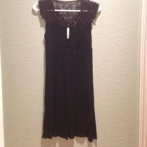 Black dress with lace detail on shoulders and back