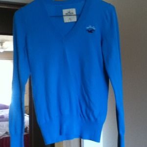 A bright blue Hollister sweater