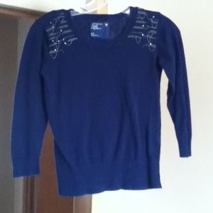 A blue crop sweater