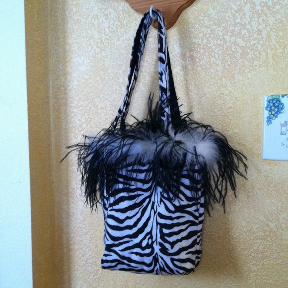 Lowered from $18 to $14 Zebra carry bag/w feathers