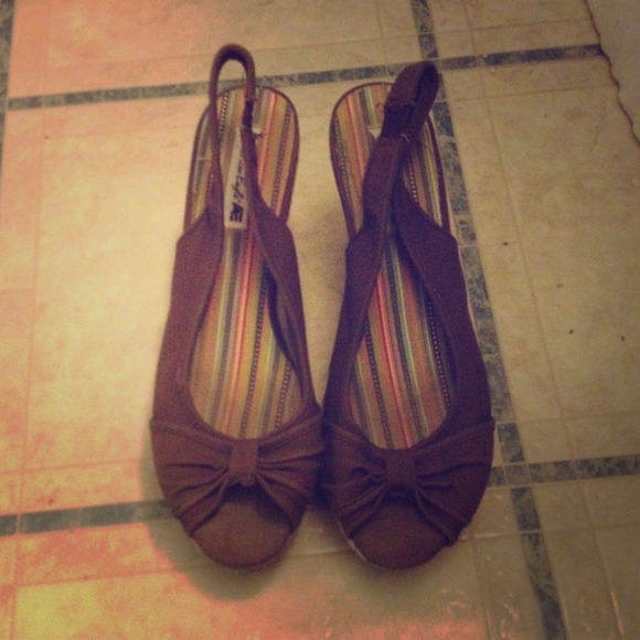 Brown wedge heels.