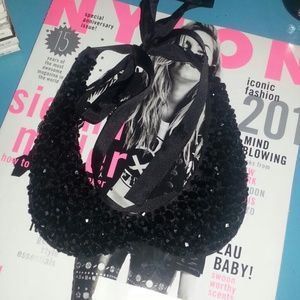 Black beaded bib necklace.