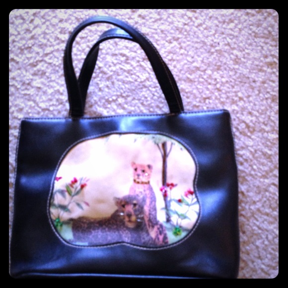 Small black purse with picture of tigers on front. - Picture 1 of 1