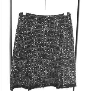 Black A-line suit skirt.