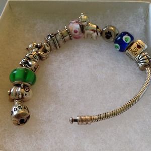The pandora bracelet, with all charms and stoppers