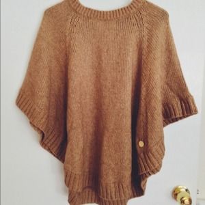 Looks great with fur scarf. MK soft woolen poncho