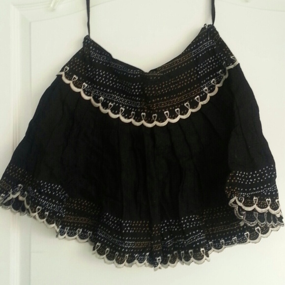 Short black skirt with white embroidered edges