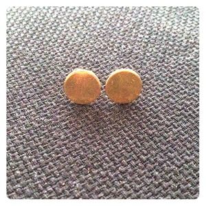 Gold plated flat pad ear studs.