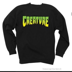 Creature crew neck