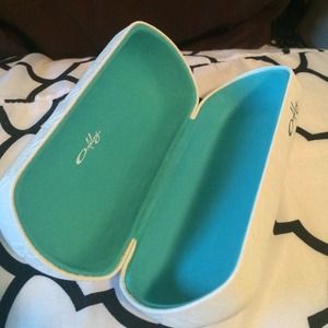 White Oakley hard case glasses holder.