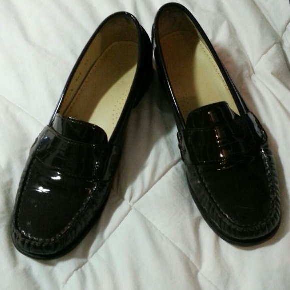 Cole Haan dark brown penny loafers.