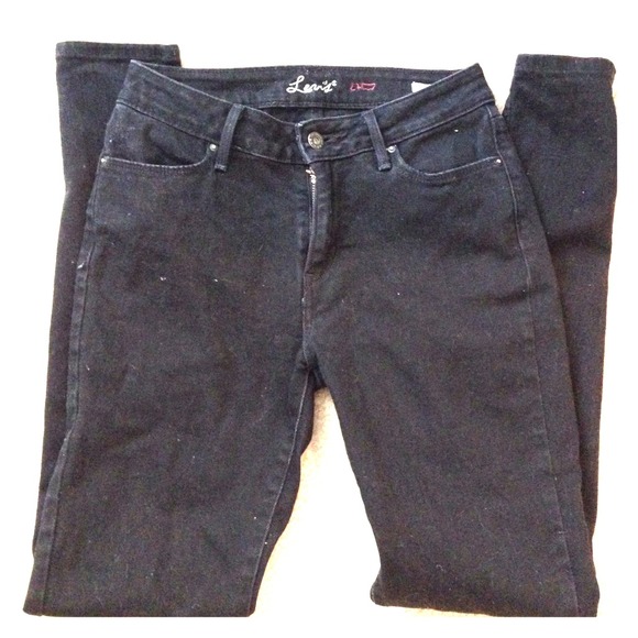 Pair of pure black Levi's skinny jeans.