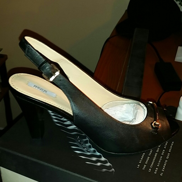 Black and gold heels toe out