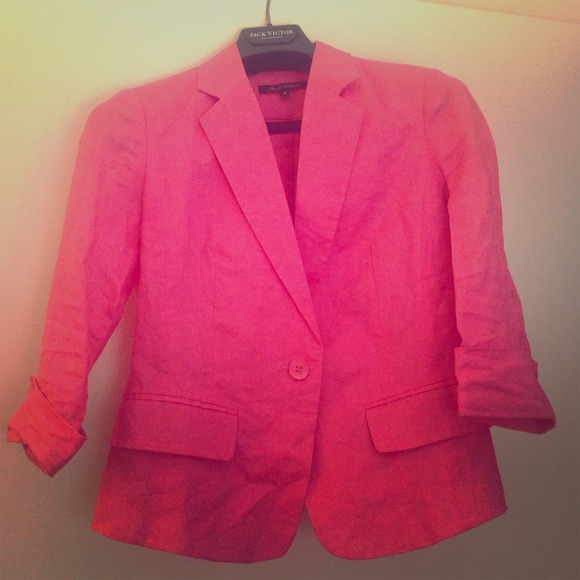 Coral colored blazer.