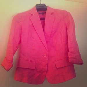 Coral colored blazer.