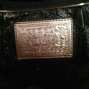 Reduced 100% authentic black poppy coach